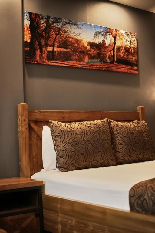 Postel nebo postele na pokoji v ubytování Zengin City Hotel