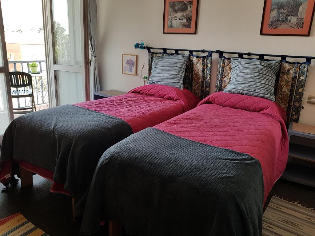 Postel nebo postele na pokoji v ubytování Guesthouse La Rocca