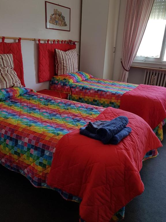 Postel nebo postele na pokoji v ubytování Guesthouse La Rocca
