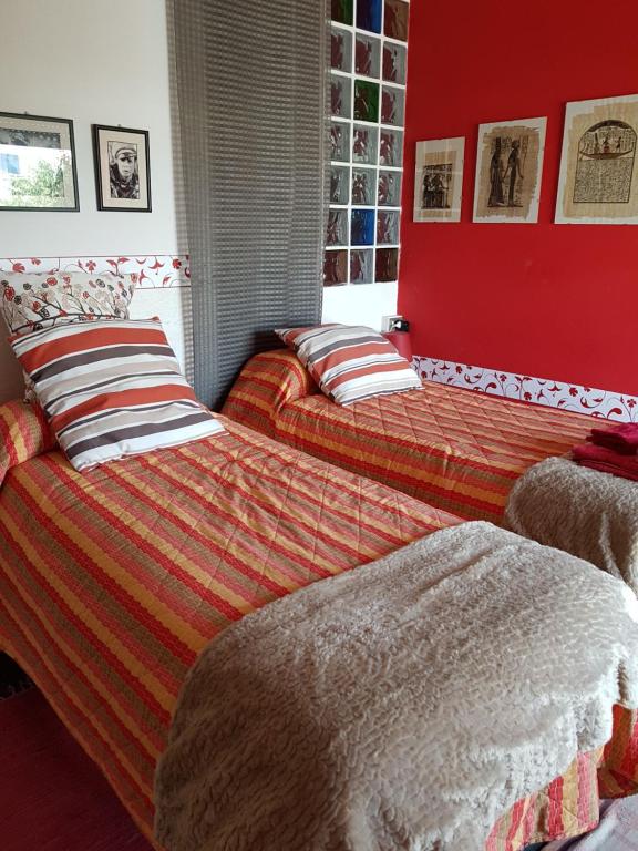 Postel nebo postele na pokoji v ubytování Guesthouse La Rocca