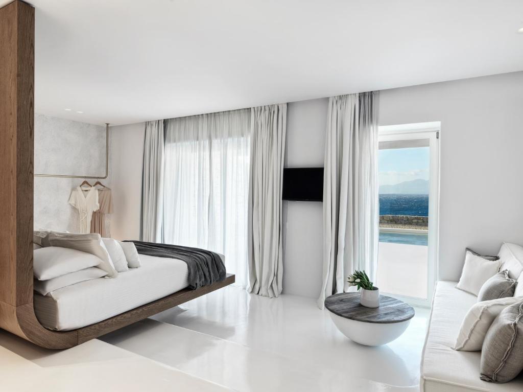 A bed or beds in a room at Mykonos Earth Suites