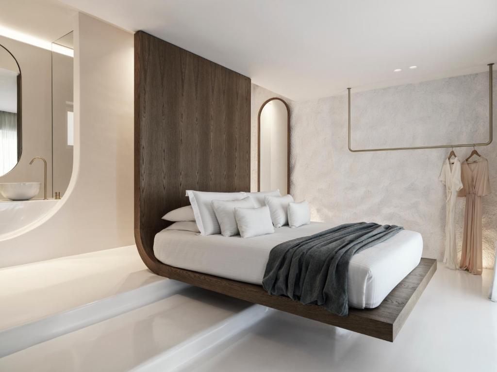 A bed or beds in a room at Mykonos Earth Suites