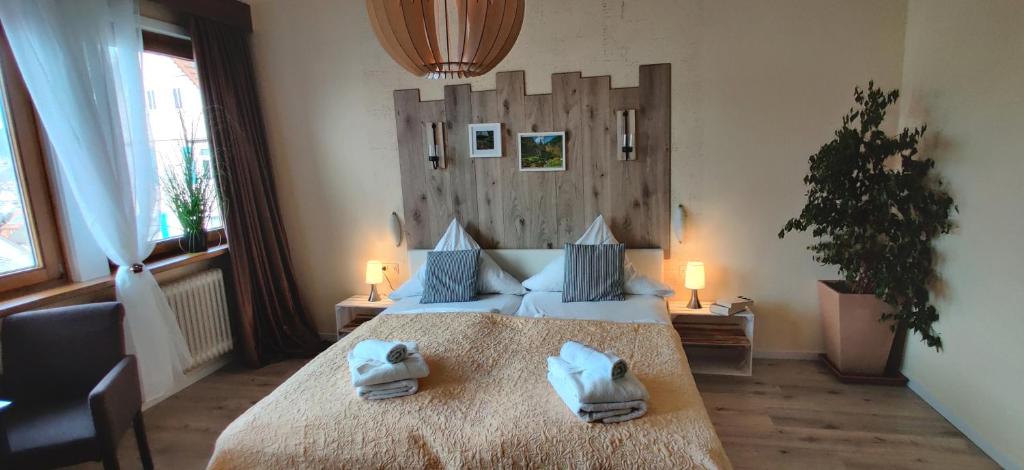 Postel nebo postele na pokoji v ubytování Hotel Restaurant Tomahawk