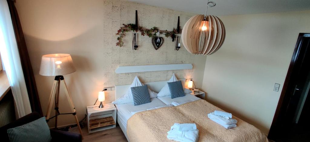 Postel nebo postele na pokoji v ubytování Hotel Restaurant Tomahawk