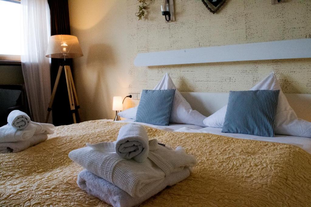 Postel nebo postele na pokoji v ubytování Hotel Restaurant Tomahawk