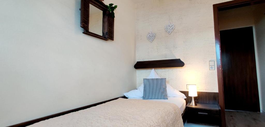 Postel nebo postele na pokoji v ubytování Hotel Restaurant Tomahawk