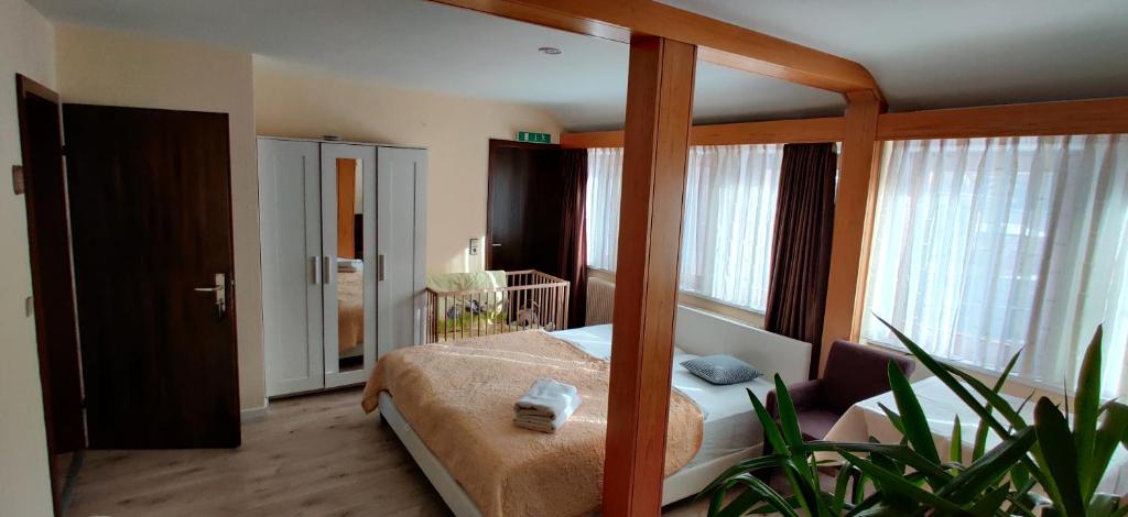 Postel nebo postele na pokoji v ubytování Hotel Restaurant Tomahawk