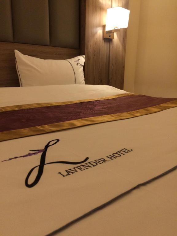 Postel nebo postele na pokoji v ubytování Lavender Serviced Apartments