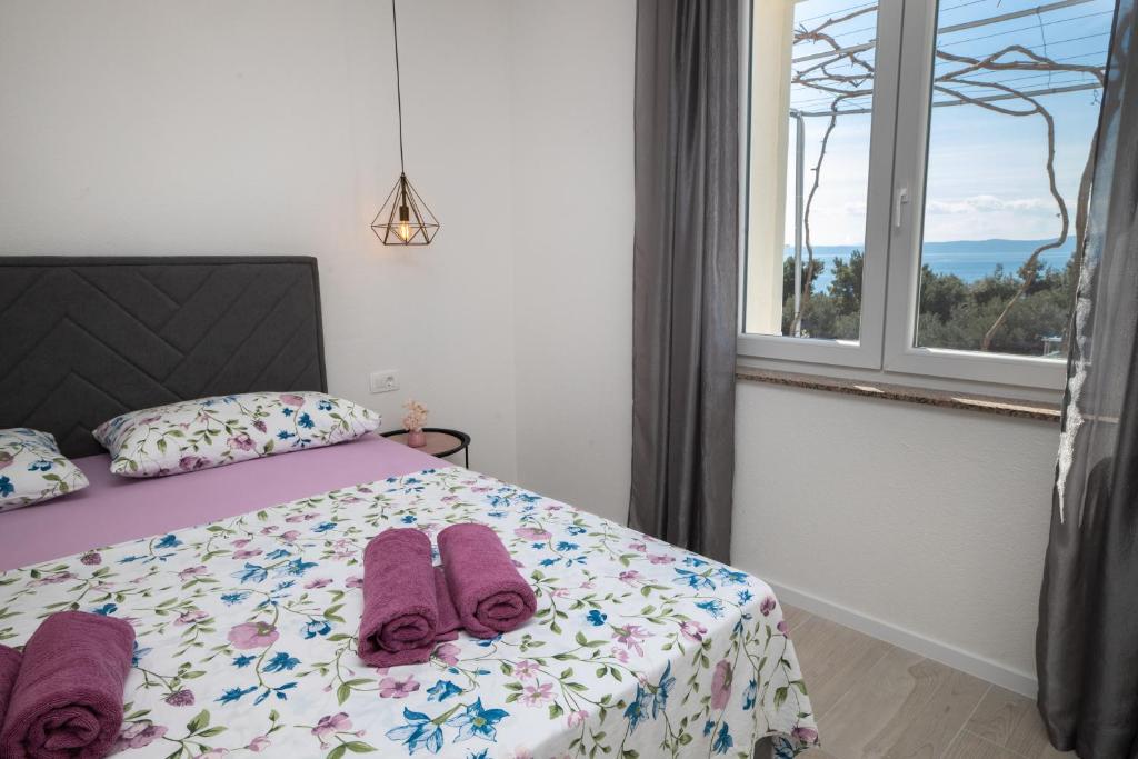 Postel nebo postele na pokoji v ubytování Apartmani Tomaš