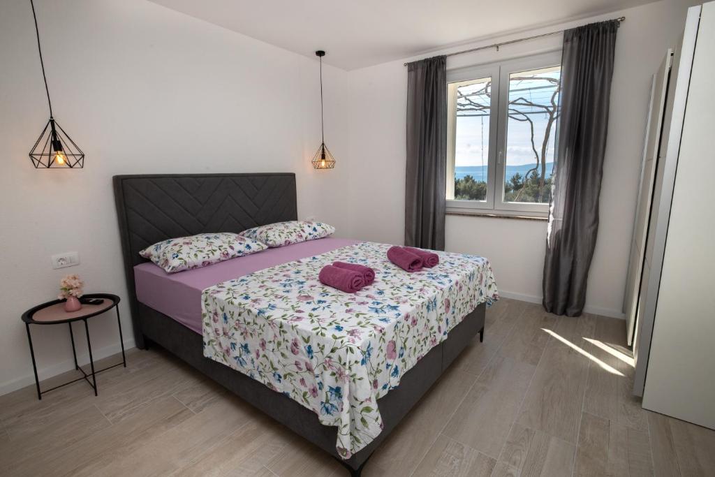 Postel nebo postele na pokoji v ubytování Apartmani Tomaš