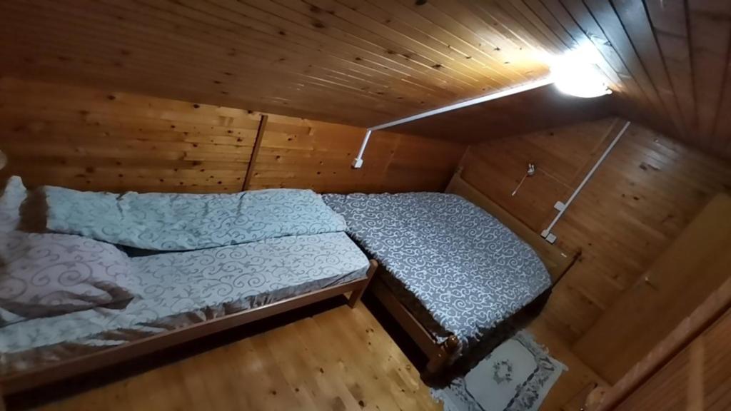 Postel nebo postele na pokoji v ubytování Vila President Divcibare