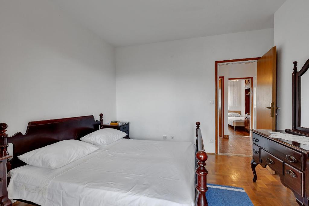 Posteľ alebo postele v izbe v ubytovaní Apartments Tihomir Mušac