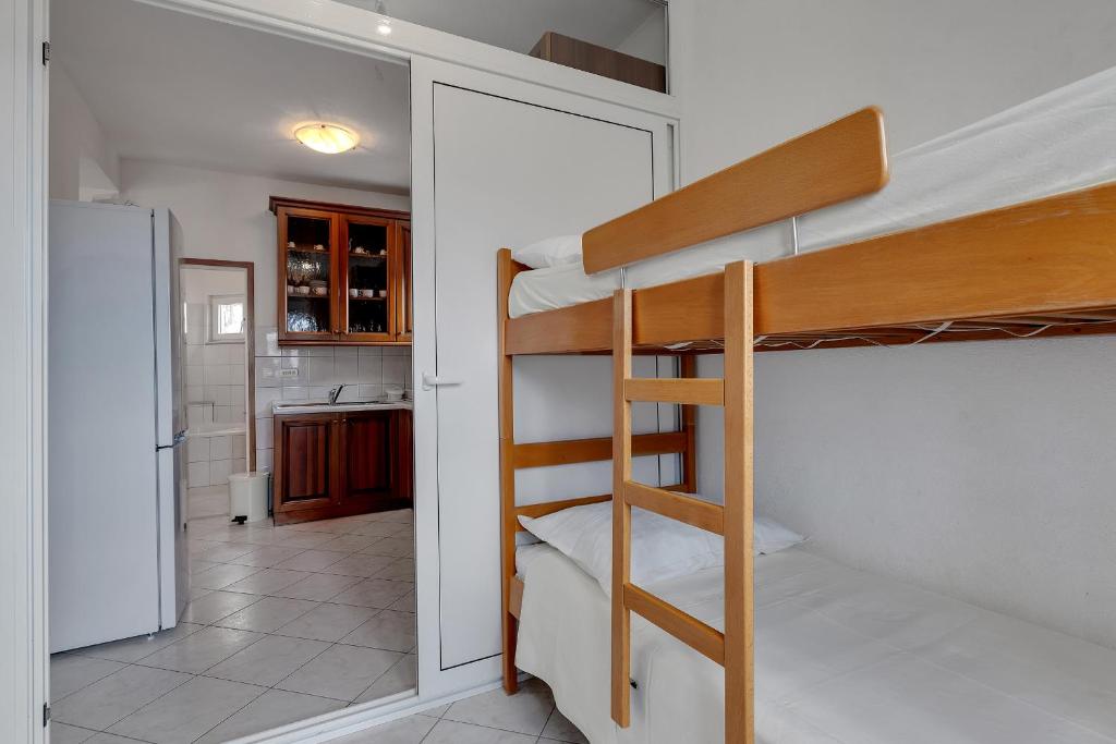 Posteľ alebo postele v izbe v ubytovaní Apartments Tihomir Mušac