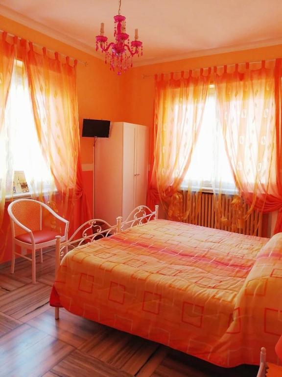 Postel nebo postele na pokoji v ubytování Hotel Serenella