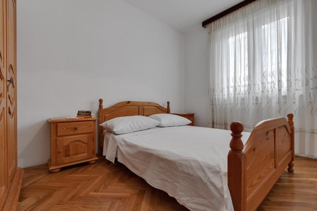Posteľ alebo postele v izbe v ubytovaní Apartments Tihomir Mušac