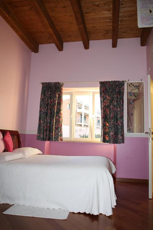 A bed or beds in a room at Bed and Breakfast Angolo Fiorito