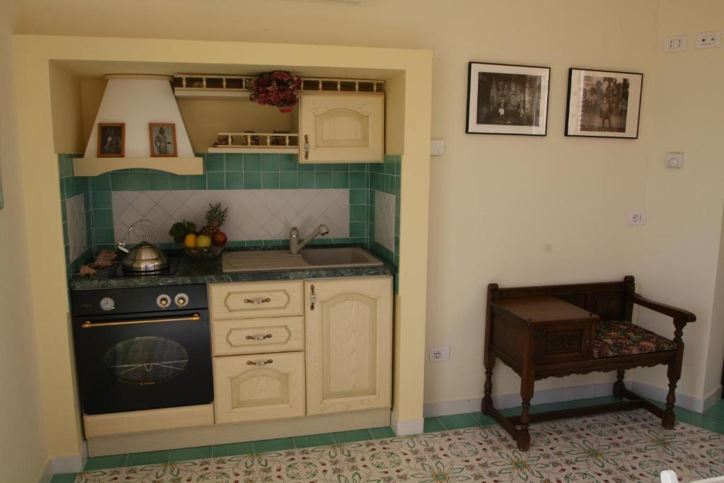 A kitchen or kitchenette at Bed and Breakfast Angolo Fiorito