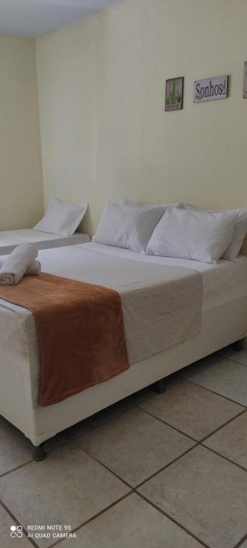 Cama ou camas em um quarto em Pousada Nordestina