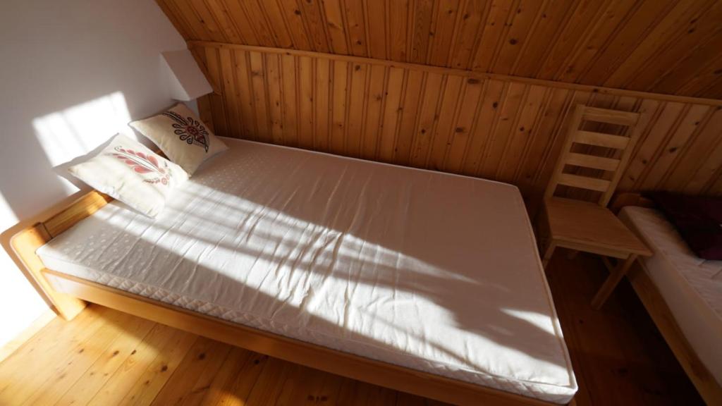 Posteľ alebo postele v izbe v ubytovaní Zawoja Dom Czatoża