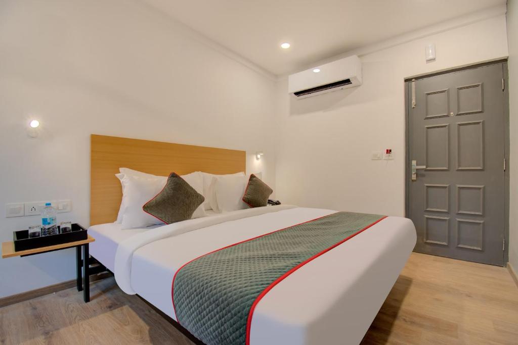Postel nebo postele na pokoji v ubytování Hotel Maitrayee