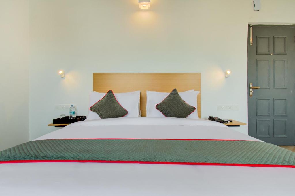 Postel nebo postele na pokoji v ubytování Hotel Maitrayee
