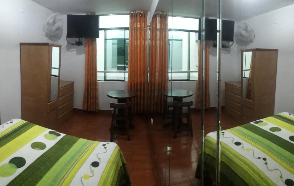 Postel nebo postele na pokoji v ubytování Hostal Sueños