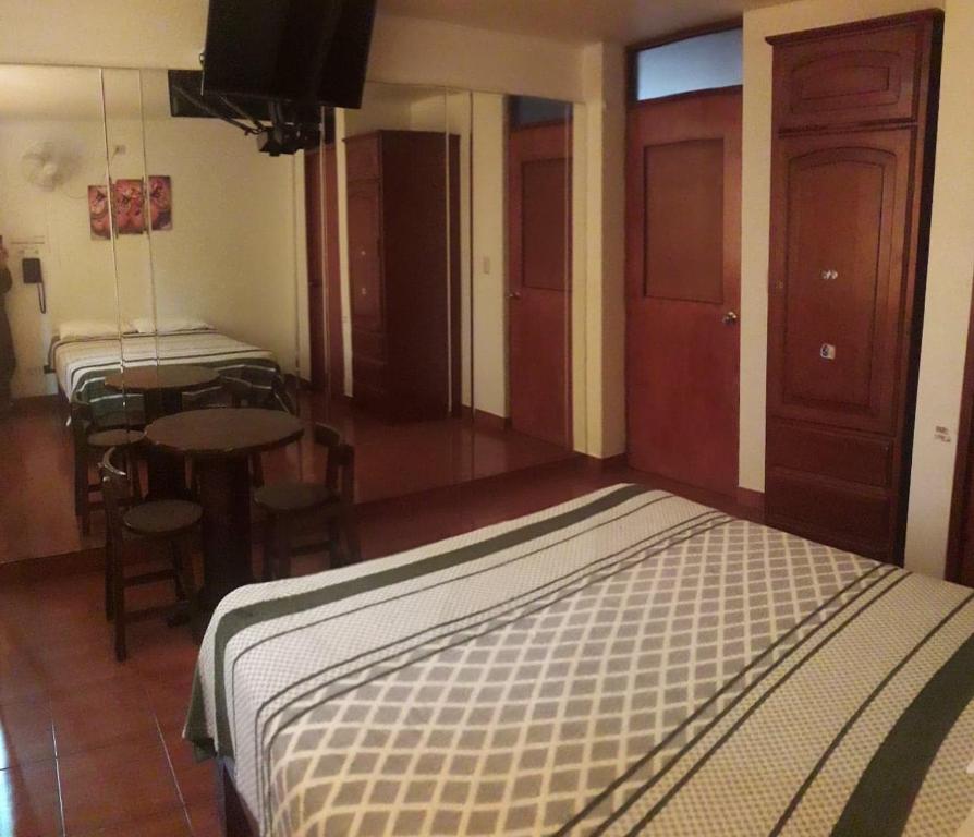 Postel nebo postele na pokoji v ubytování Hostal Sueños