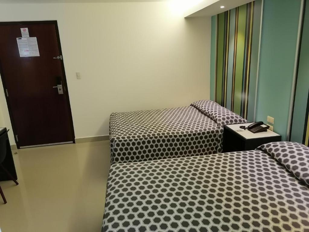 Postel nebo postele na pokoji v ubytování Hotel Mar y Tierra