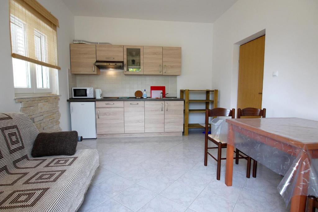 Kuchyň nebo kuchyňský kout v ubytování Paklenica Sport Apartments