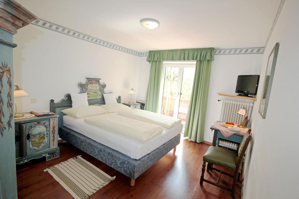 Posteľ alebo postele v izbe v ubytovaní Hotel Sonnenhof - bed & breakfast & appartements