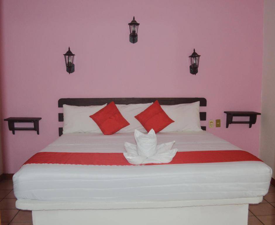 Postel nebo postele na pokoji v ubytování Hotel Kashlan Palenque