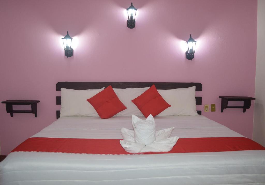 Postel nebo postele na pokoji v ubytování Hotel Kashlan Palenque