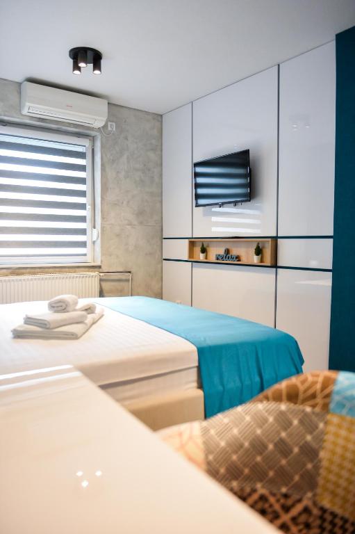 Postel nebo postele na pokoji v ubytování Garni hotel King