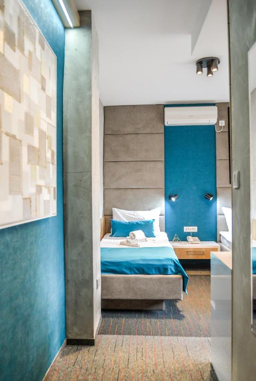 Postel nebo postele na pokoji v ubytování Garni hotel King