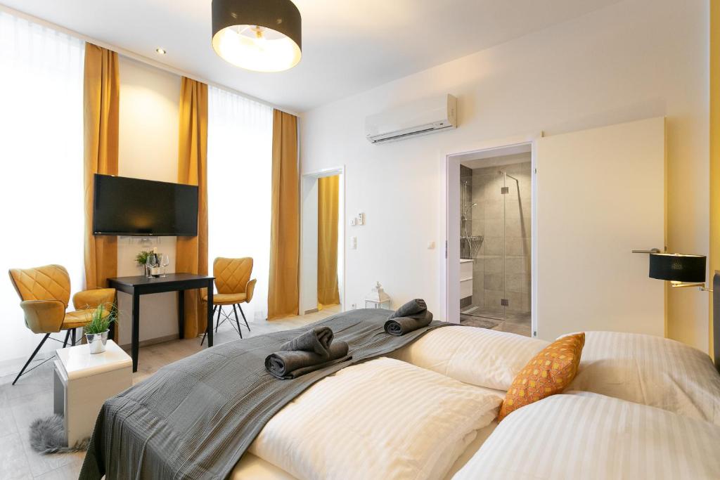 Postel nebo postele na pokoji v ubytování WF-Apartment Westbahnhof