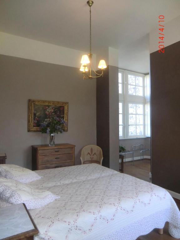 Postel nebo postele na pokoji v ubytování Château de Fourcès