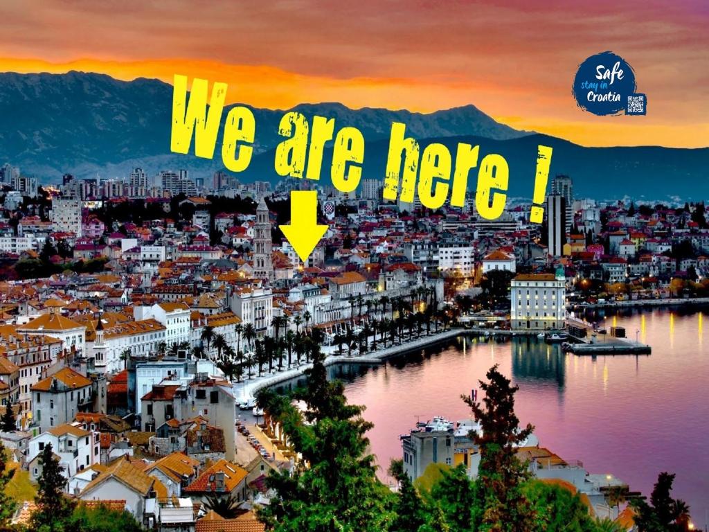 a poster of a city with the words we are here at Split Center Apartments in Split