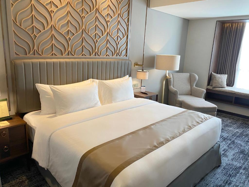 Katil atau katil-katil dalam bilik di Sutasoma Hotel