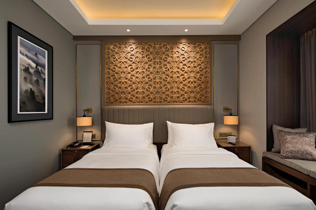 Katil atau katil-katil dalam bilik di Sutasoma Hotel
