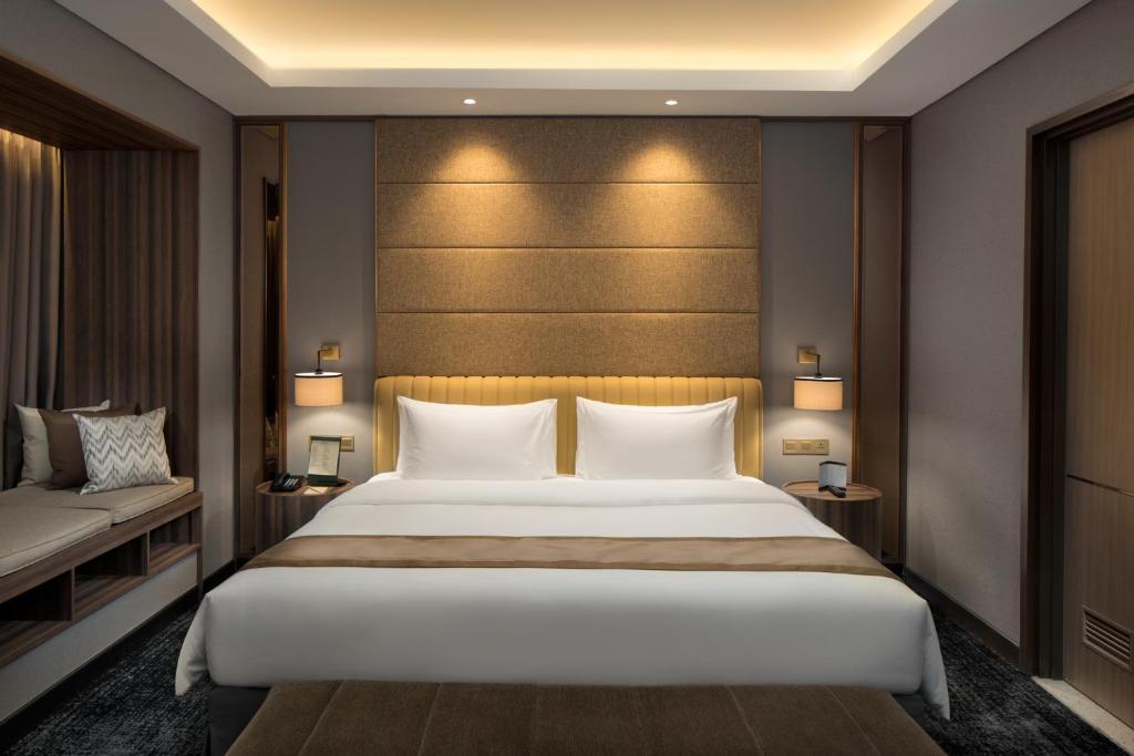 Katil atau katil-katil dalam bilik di Sutasoma Hotel