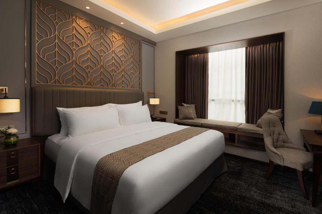 Katil atau katil-katil dalam bilik di Sutasoma Hotel