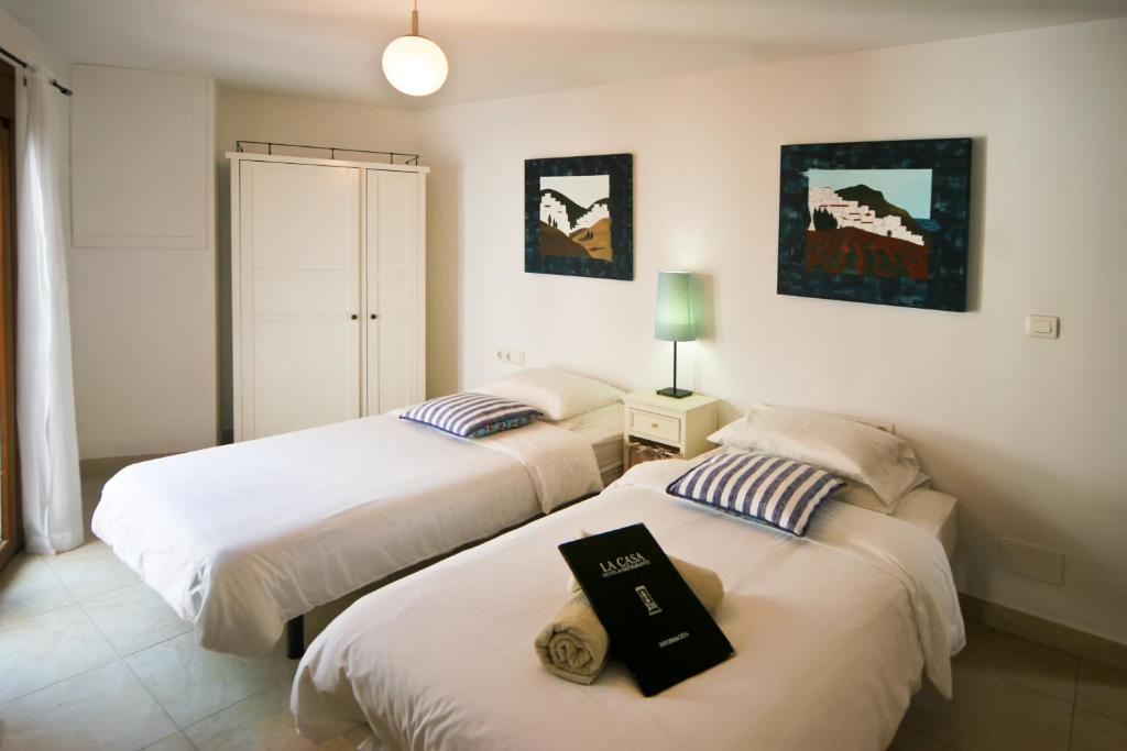 Postel nebo postele na pokoji v ubytování Hotel La Casa