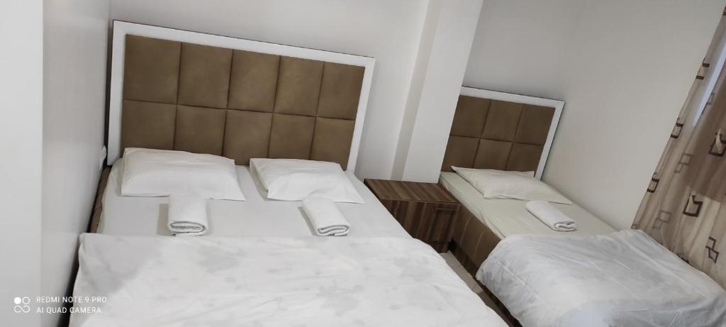 Postel nebo postele na pokoji v ubytování Hotel Heimli