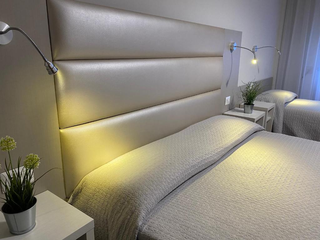 Postel nebo postele na pokoji v ubytování Hotel Due Giardini