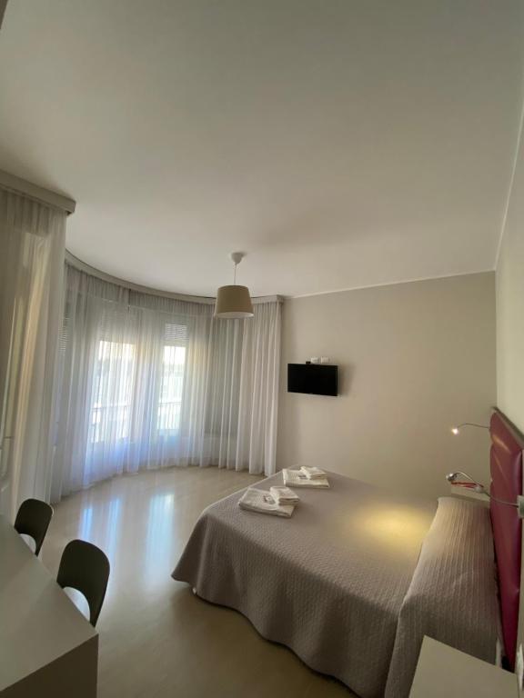 Postel nebo postele na pokoji v ubytování Hotel Due Giardini