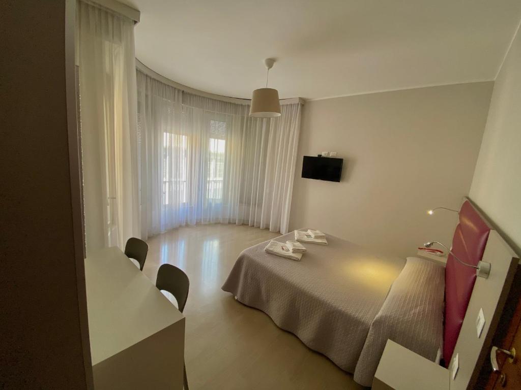Postel nebo postele na pokoji v ubytování Hotel Due Giardini