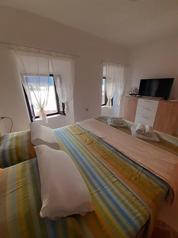 En eller flere senger på et rom på BellaVistaZmukic Guesthouse