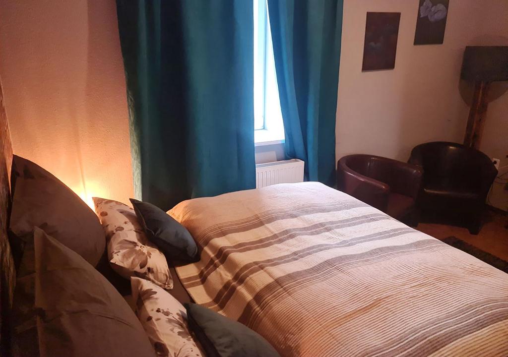 Postel nebo postele na pokoji v ubytování Hotel Geismarburg