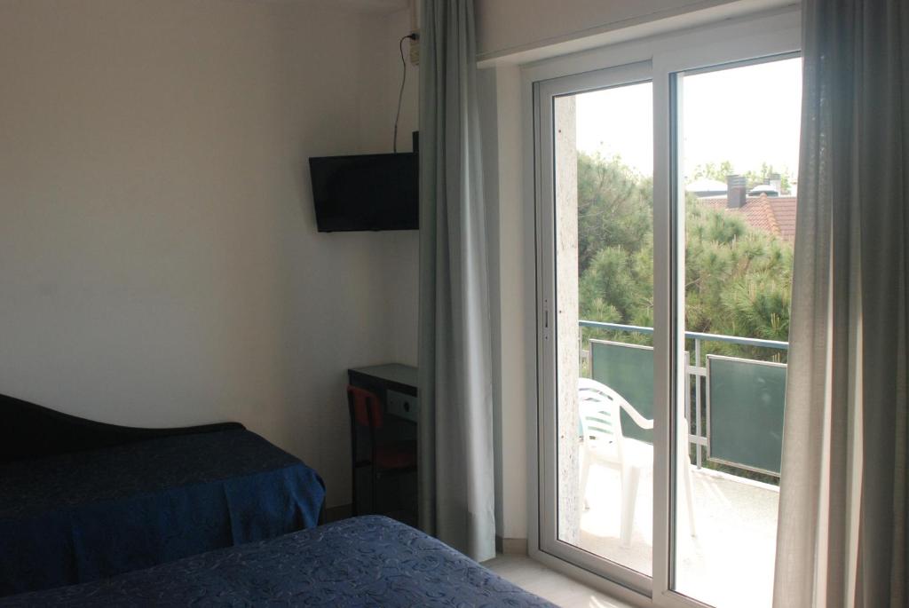 Postel nebo postele na pokoji v ubytování Hotel Caravelle