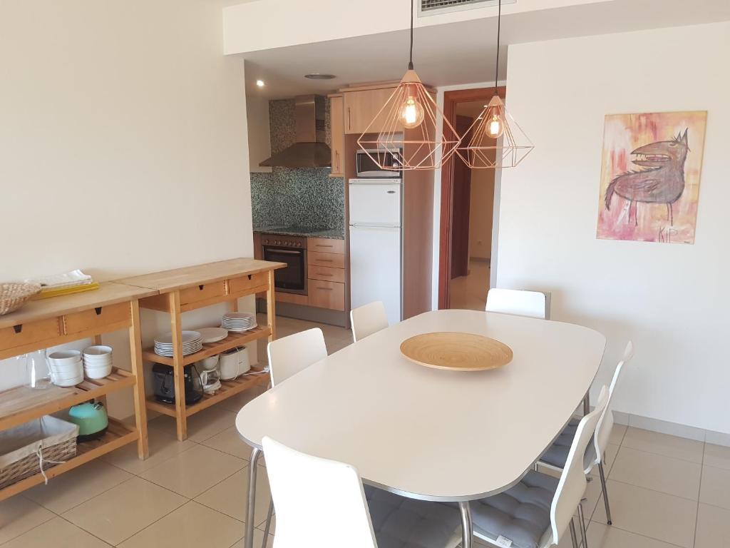 A kitchen or kitchenette at Beautiful apartment 75m2 with view at the beach, pool, parking